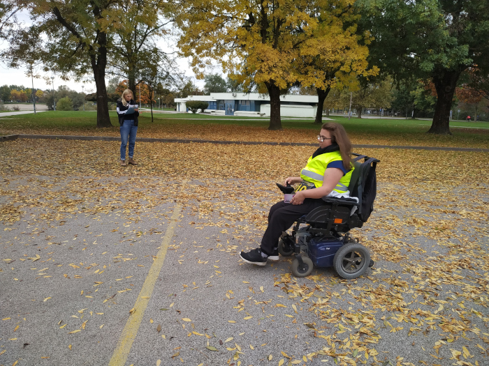 a participant in a motorized wheelchair enters the finish line